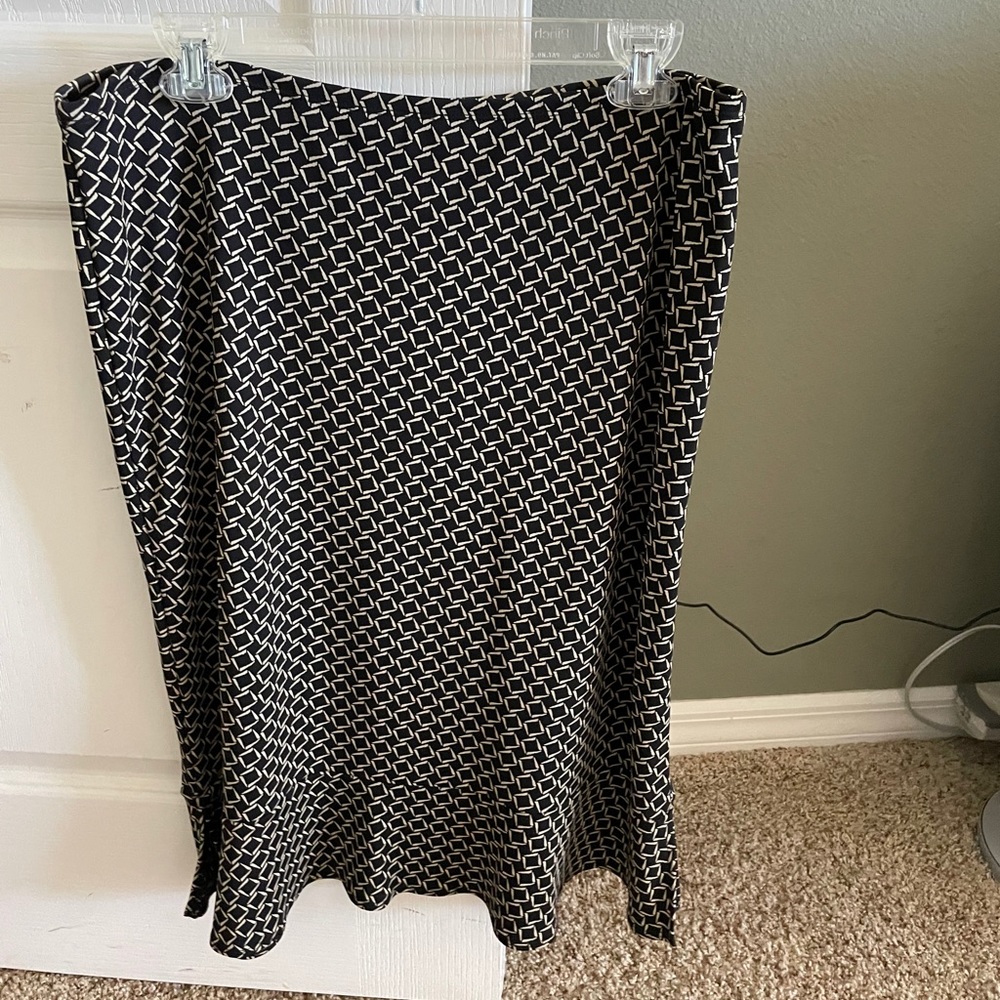 Black and cream colored skirt